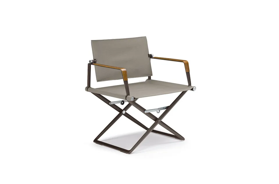 Dedon Seax lounge chair armrest with sea-bent plywood finish - black pepper frame, studio photo